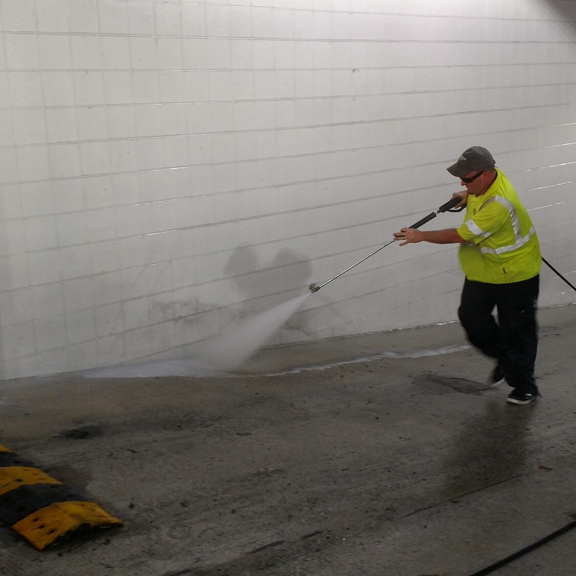 Pressure washing garage lot